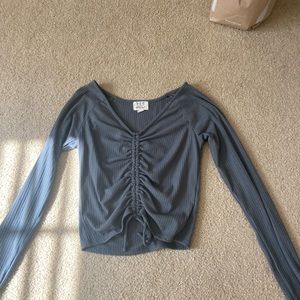 Stunning green long sleeve top with ruching down the middle